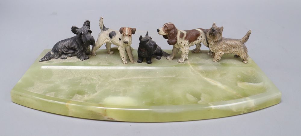 A cold painted bronze dish, modelled with terriers and a spaniel, length 36cm